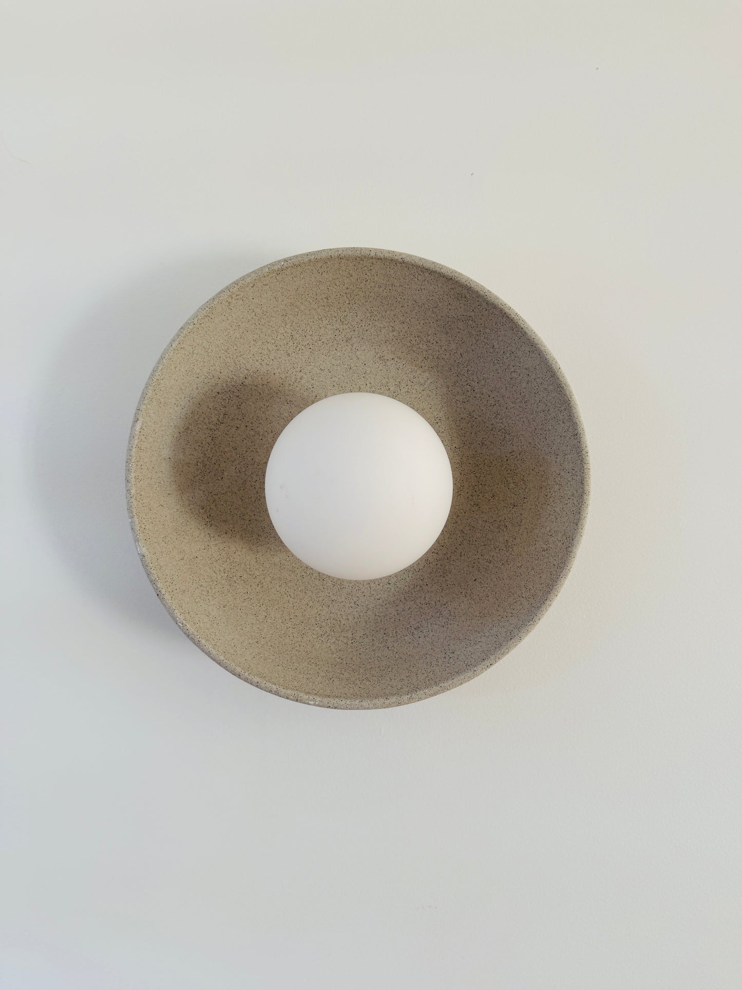 Natural clay wall sconce