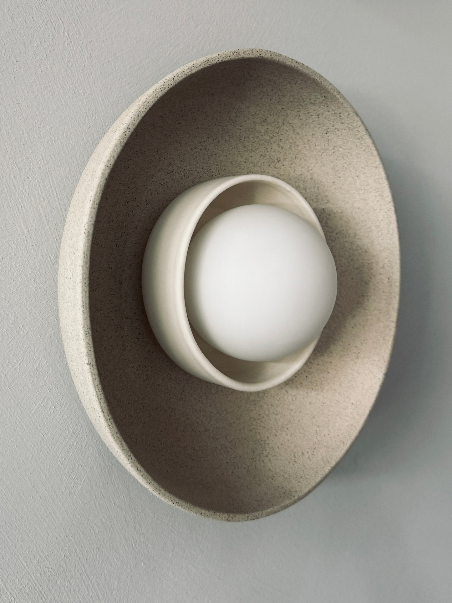 Natural clay wall sconce
