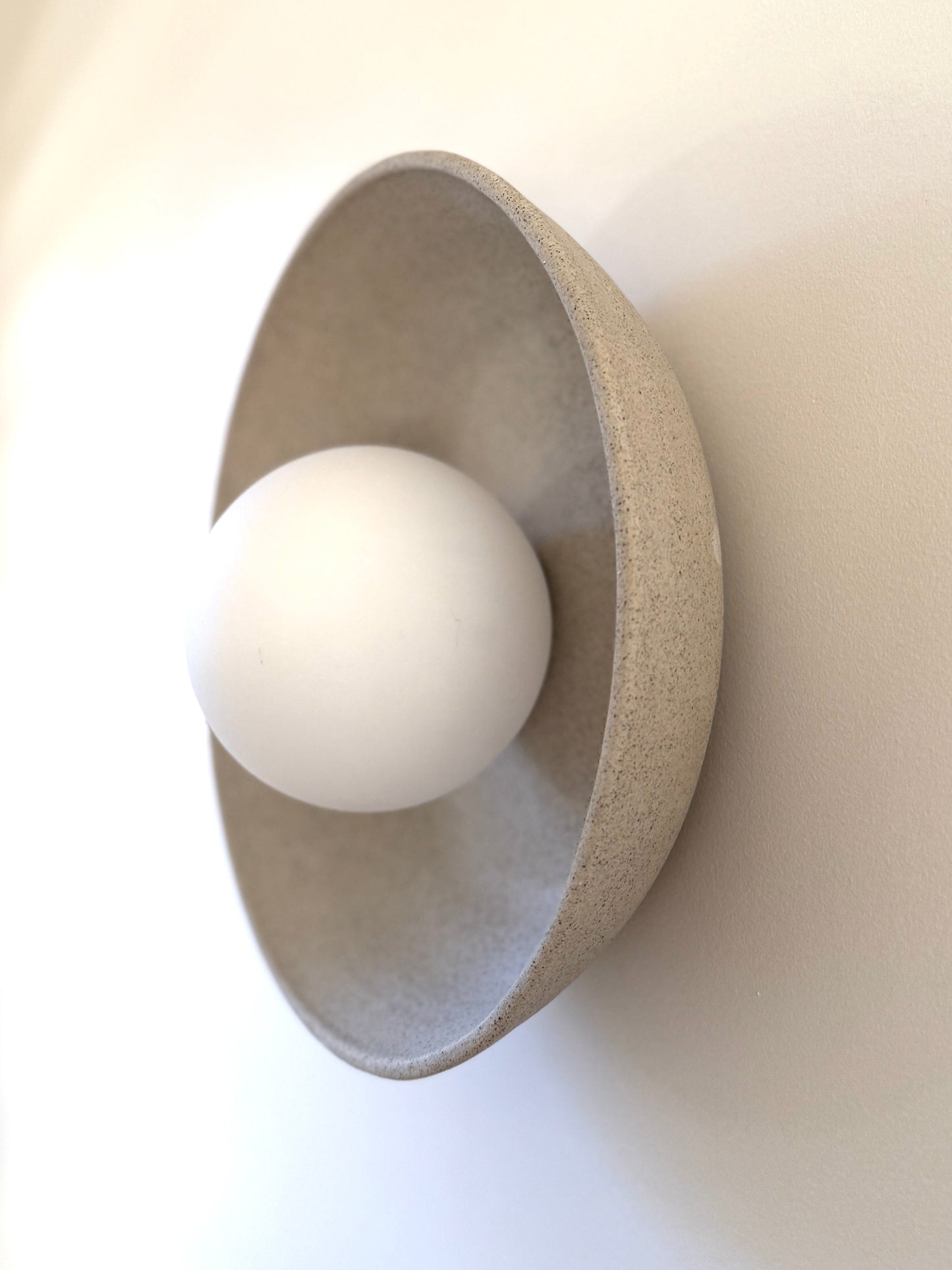 Natural clay wall sconce